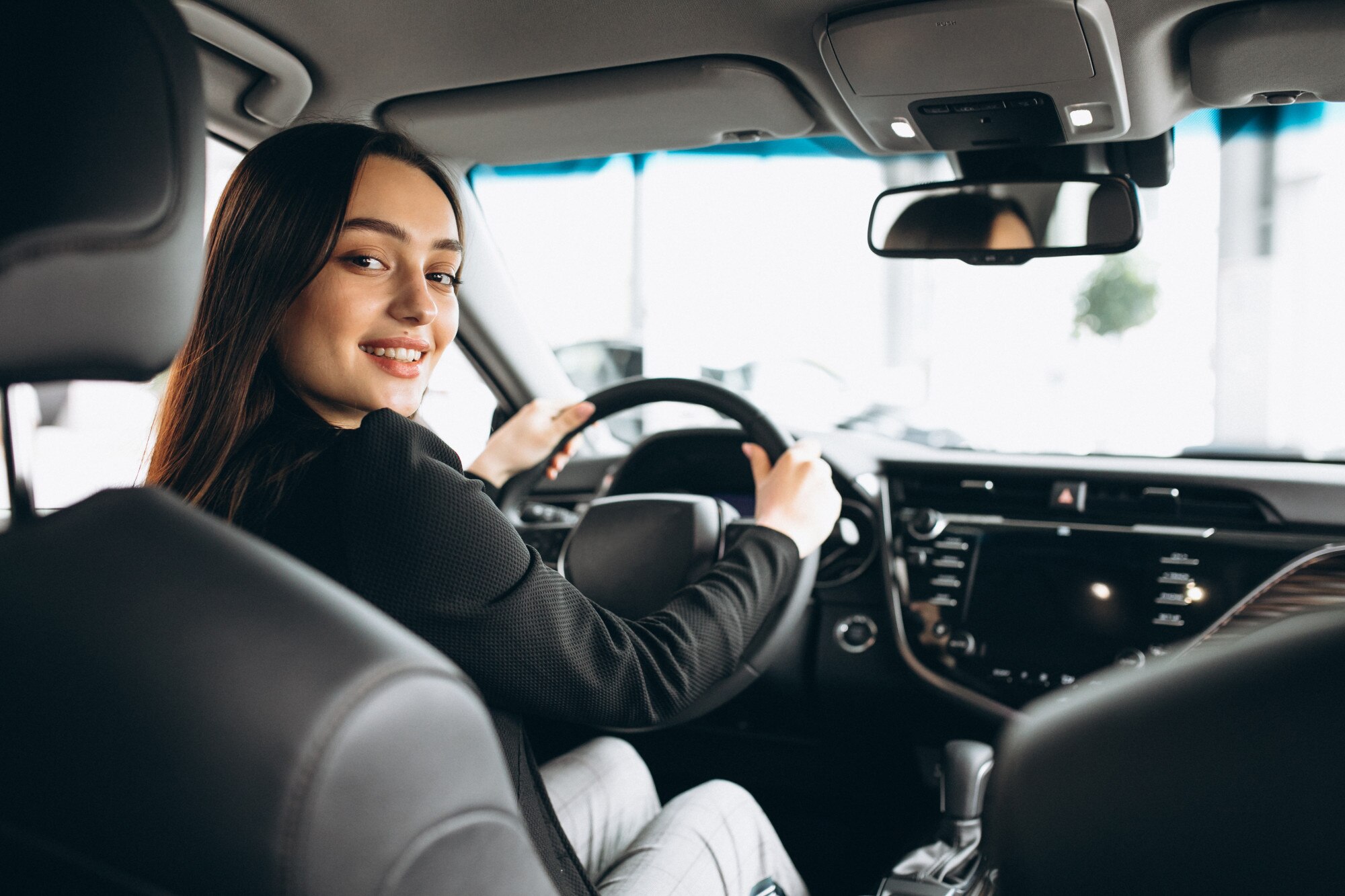 young woman testing car car showroom_1303 17732
